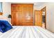 Bedroom featuring a large wooden wardrobe and a view into the living space at 200 The Lane Rd, Golden, CO 80403