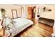 Bright bedroom featuring hardwood floors, fresh colors, and a well-lit and airy atmosphere at 200 The Lane Rd, Golden, CO 80403