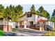 Charming two-story home with a deck and lush trees, offering a serene and private setting at 200 The Lane Rd, Golden, CO 80403