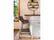 Close up of kitchen island showing barstool seating, butcher block countertop, and white cabinets at 200 The Lane Rd, Golden, CO 80403