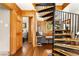 Inviting living room featuring wood paneling, spiral staircase, and comfortable seating area at 200 The Lane Rd, Golden, CO 80403
