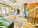 Inviting living room with wood floors, fireplace, and bar-style kitchen, creating a cozy and stylish space at 200 The Lane Rd, Golden, CO 80403