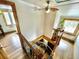 Unique winding staircase with wood and iron detailing leading to the lower floor with natural light at 200 The Lane Rd, Golden, CO 80403