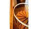 Close-up of spiral staircase showing wooden steps and metal railing at 200 The Lane Rd, Golden, CO 80403