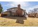 Spacious backyard features brick firepit, patio, and mature landscaping at 15407 E Crestline Pl, Centennial, CO 80015