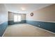 Spacious carpeted basement with painted walls and modern window at 15407 E Crestline Pl, Centennial, CO 80015