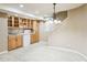 Finished basement with cabinets, sink, and wine rack, perfect for entertaining at 15407 E Crestline Pl, Centennial, CO 80015