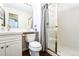 Modern bathroom offers a walk-in shower, sink, and updated toilet at 15407 E Crestline Pl, Centennial, CO 80015