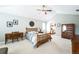Bedroom with ceiling fan, vaulted ceiling, writing desk and view to ensuite bathroom at 15407 E Crestline Pl, Centennial, CO 80015
