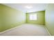 Empty bedroom featuring neutral paint, carpet, a window with plantation shutters, and ample space at 15407 E Crestline Pl, Centennial, CO 80015