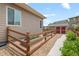 Side yard with a fenced garden area and convenient storage shed at 17358 W 95Th Ave, Arvada, CO 80007