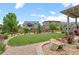 Spacious backyard featuring a large lawn, landscaping, and fencing at 17358 W 95Th Ave, Arvada, CO 80007