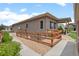 Exterior shot of the side yard with a fenced in garden and a shed at 17358 W 95Th Ave, Arvada, CO 80007