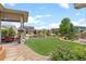 Beautiful backyard with a stone patio area and lots of greenery at 17358 W 95Th Ave, Arvada, CO 80007