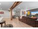 Basement space with a beam, bar area, television, and movie posters at 17358 W 95Th Ave, Arvada, CO 80007
