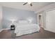 Well-lit bedroom featuring a neutral color scheme and ceiling fan at 17358 W 95Th Ave, Arvada, CO 80007