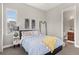 Comfortable bedroom with an ensuite bathroom, offering convenience and privacy at 17358 W 95Th Ave, Arvada, CO 80007