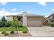 Charming home with a two-car garage and well-manicured landscaping at 17358 W 95Th Ave, Arvada, CO 80007