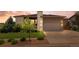Charming single-Gathering home featuring a two-car garage, well-maintained lawn, and professional landscaping at 17358 W 95Th Ave, Arvada, CO 80007