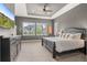 Spacious main bedroom with a trey ceiling, plush carpeting, and abundant natural light from large windows at 17358 W 95Th Ave, Arvada, CO 80007