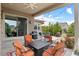 A covered patio with stylish outdoor furniture and a view of the backyard at 17358 W 95Th Ave, Arvada, CO 80007