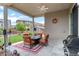 Outdoor covered patio with view to landscaped yard and shed at 17358 W 95Th Ave, Arvada, CO 80007