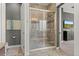 Modern tile shower with frameless glass enclosure, and updated fixtures offering a spa-like experience at 17358 W 95Th Ave, Arvada, CO 80007