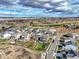 Expansive aerial view displays the backyard with manicured lawns and landscaping, as well as a neighborhood adjacent to a golf course at 11950 Mosey Ct, Parker, CO 80138