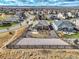 Panoramic aerial view of a home featuring a meticulously landscaped backyard, situated within a well-planned community at 11950 Mosey Ct, Parker, CO 80138