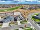 Aerial view showcases a residence near a golf course and open space, featuring a fenced yard and well-maintained landscaping at 11950 Mosey Ct, Parker, CO 80138