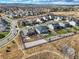 Drone shot capturing home within a community, showcasing landscaped yard and proximity to other residences in a planned neighborhood at 11950 Mosey Ct, Parker, CO 80138