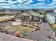 Landscaped backyard with gravel, grass and patio of a well-maintained single-Gathering home on a sunny day at 11950 Mosey Ct, Parker, CO 80138