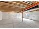 Unfinished basement with a window offers an opportunity for customization and additional living space at 11950 Mosey Ct, Parker, CO 80138