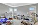 Bedroom showcasing ample natural light and neutral walls and carpet at 11950 Mosey Ct, Parker, CO 80138