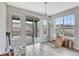 Bright dining area with large windows and a sliding door to the patio for seamless indoor-outdoor living at 11950 Mosey Ct, Parker, CO 80138