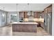 Gourmet kitchen with stainless steel appliances, a center island, and modern finishes at 11950 Mosey Ct, Parker, CO 80138