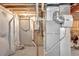 Utility room featuring essential equipment, including a furnace, and water pipes for home systems at 11950 Mosey Ct, Parker, CO 80138