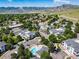 Community aerial view showcasing landscape, pool, and mountain views at 1697 S Cole St # B5, Lakewood, CO 80228