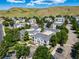 Overhead view showcasing the residential area's well-maintained homes, mature trees, and community layout at 1697 S Cole St # B5, Lakewood, CO 80228
