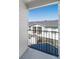 Balcony overlooking community features black iron railing and a view of other homes at 1697 S Cole St # B5, Lakewood, CO 80228