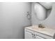 Clean powder room with white vanity cabinet and stylish fixtures at 1697 S Cole St # B5, Lakewood, CO 80228