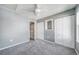 Bedroom with neutral paint and carpet, a ceiling fan, and built-in shelving at 1697 S Cole St # B5, Lakewood, CO 80228