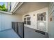 Welcoming entryway with decorative glass door, side window, and a cheerful 'Home' doormat at 1697 S Cole St # B5, Lakewood, CO 80228