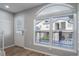 Bright entryway featuring a decorative front door, large window, and stylish hooks at 1697 S Cole St # B5, Lakewood, CO 80228