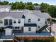 Exterior view of condo, showing second story balcony and brick base at 1697 S Cole St # B5, Lakewood, CO 80228
