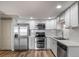 Updated kitchen featuring stainless steel appliances and a modern design at 1697 S Cole St # B5, Lakewood, CO 80228