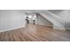 Spacious open layout featuring the living room, staircase, and adjacent kitchen at 1697 S Cole St # B5, Lakewood, CO 80228