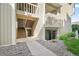 Exterior entrance of the condo with stairs leading to the upper units and a covered entrance to the lower unit at 4068 S Atchison Way # 103, Aurora, CO 80014