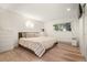 The main bedroom is bright and spacious, with a large window and a hardwood floor at 4068 S Atchison Way # 103, Aurora, CO 80014