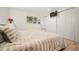Bright and spacious main bedroom featuring a large window and a double-door closet at 4068 S Atchison Way # 103, Aurora, CO 80014